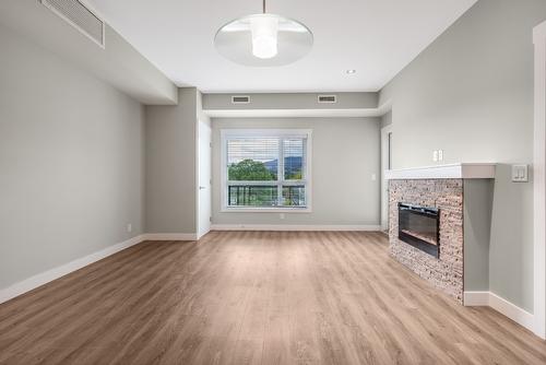 405-1883 Water Street, Kelowna, BC - Indoor With Fireplace