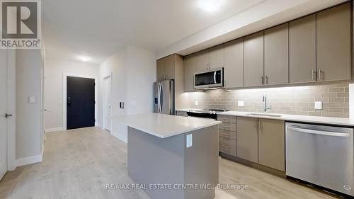 601 - 3220 William Coltson Avenue, Oakville, ON - Indoor Photo Showing Kitchen With Upgraded Kitchen