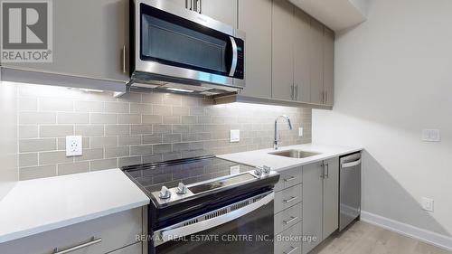 601 - 3220 William Coltson Avenue, Oakville, ON - Indoor Photo Showing Kitchen With Upgraded Kitchen