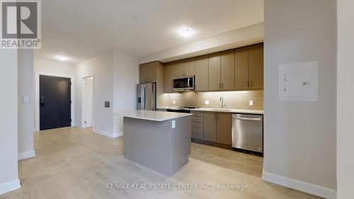 601 - 3220 William Coltson Avenue, Oakville, ON - Indoor Photo Showing Kitchen With Stainless Steel Kitchen With Upgraded Kitchen