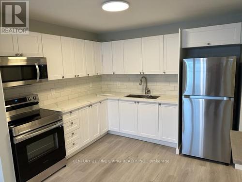 6 - 19 Church Street N, New Tecumseth (Alliston), ON - Indoor Photo Showing Kitchen With Stainless Steel Kitchen With Double Sink