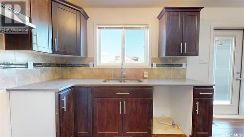 204 Chateau Crescent, Pilot Butte, SK - Indoor Photo Showing Kitchen With Double Sink