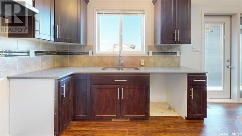 204 Chateau Crescent, Pilot Butte, SK - Indoor Photo Showing Kitchen With Double Sink