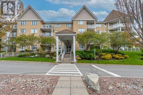 209 - 51 Rivermill Boulevard, Kawartha Lakes (Lindsay), ON - Outdoor With Balcony With Facade