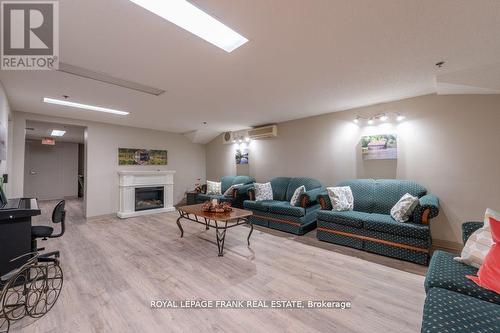 209 - 51 Rivermill Boulevard, Kawartha Lakes (Lindsay), ON - Indoor Photo Showing Other Room With Fireplace