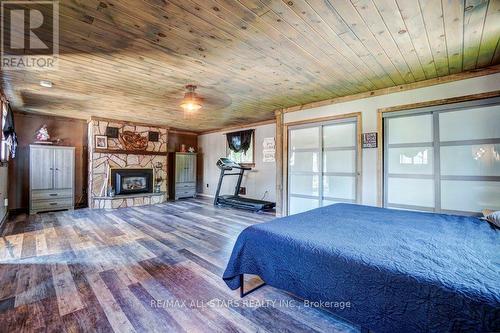 48 North Bayou Road, Kawartha Lakes (Fenelon Falls), ON - Indoor Photo Showing Bedroom With Fireplace