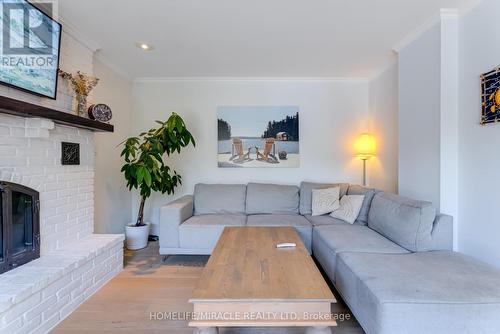 71 Nicholson Crescent, Springwater (Minesing), ON - Indoor Photo Showing Living Room With Fireplace