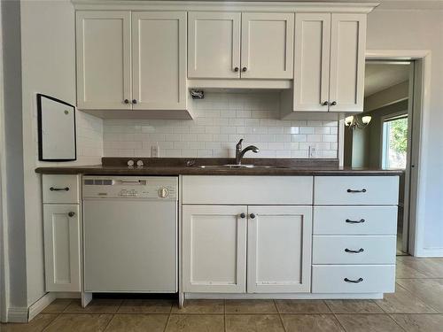 75 12Th Street Sw, Portage La Prairie, MB - Indoor Photo Showing Kitchen With Double Sink