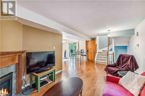 8 Beckington Private, Ottawa, ON - Indoor Photo Showing Living Room With Fireplace