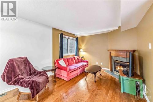 8 Beckington Private, Ottawa, ON - Indoor Photo Showing Living Room With Fireplace