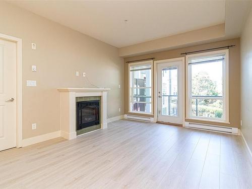 209-866 Brock Ave, Langford, BC - Indoor Photo Showing Living Room With Fireplace