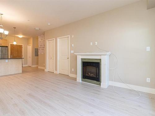 209-866 Brock Ave, Langford, BC - Indoor Photo Showing Living Room With Fireplace