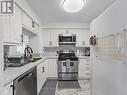 2239 - 68 Corporate Drive, Toronto (Woburn), ON  - Indoor Photo Showing Kitchen With Stainless Steel Kitchen With Double Sink 