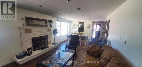 1095 Tiny Beaches Rd Road S, Tiny, ON - Indoor Photo Showing Living Room With Fireplace