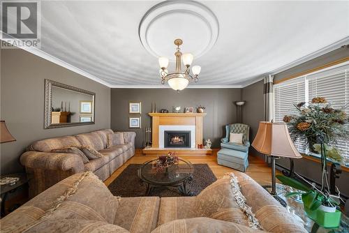 375 Cote, Chelmsford, ON - Indoor Photo Showing Living Room With Fireplace