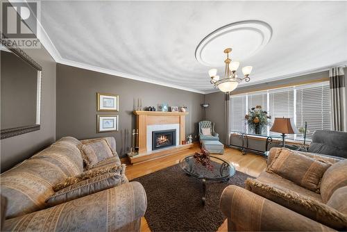 375 Cote, Chelmsford, ON - Indoor Photo Showing Living Room With Fireplace