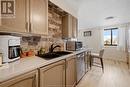 150 Park Street West Unit# 1307, Windsor, ON  - Indoor Photo Showing Kitchen With Double Sink 