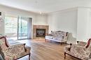 310-1966 Enterprise Way, Kelowna, BC  - Indoor Photo Showing Living Room With Fireplace 