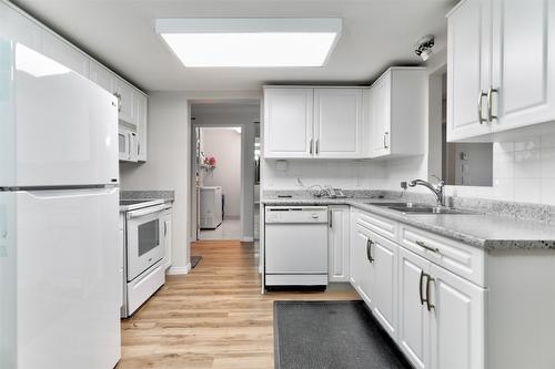 310-1966 Enterprise Way, Kelowna, BC - Indoor Photo Showing Kitchen With Double Sink