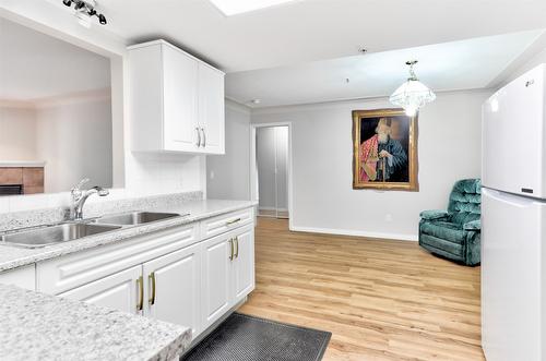 310-1966 Enterprise Way, Kelowna, BC - Indoor Photo Showing Kitchen With Double Sink