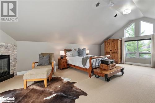 21 Trails End, Collingwood, ON - Indoor Photo Showing Bedroom With Fireplace