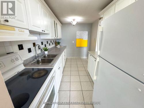 908 - 3120 Kirwin Avenue, Mississauga, ON - Indoor Photo Showing Kitchen With Double Sink