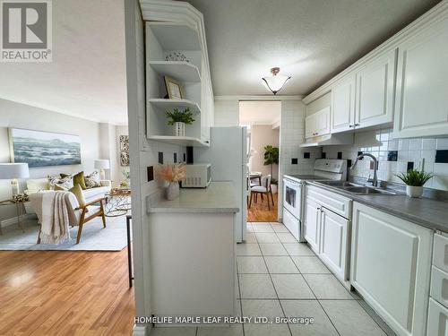 908 - 3120 Kirwin Avenue, Mississauga, ON - Indoor Photo Showing Kitchen With Double Sink