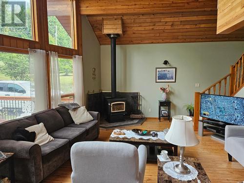 432 Bayles Road, Nakusp, BC - Indoor Photo Showing Living Room With Fireplace