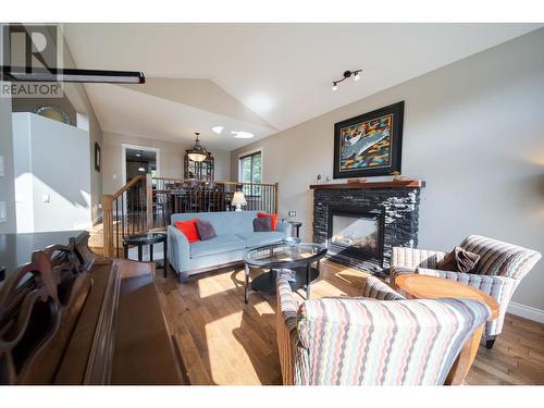 831 309Th  Street, Cranbrook, BC - Indoor Photo Showing Living Room With Fireplace