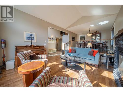 831 309Th  Street, Cranbrook, BC - Indoor Photo Showing Living Room With Fireplace