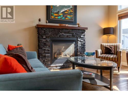 831 309Th  Street, Cranbrook, BC - Indoor Photo Showing Living Room With Fireplace