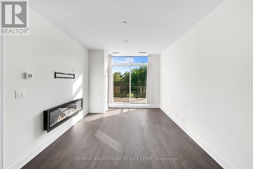 404 - 1575 Lakeshore Road N, Mississauga (Clarkson), ON - Indoor Photo Showing Other Room With Fireplace