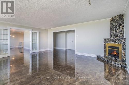 2105 - 1285 Cahill Drive, Ottawa, ON - Indoor Photo Showing Other Room With Fireplace