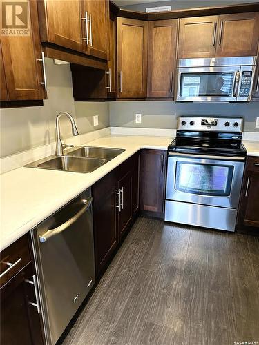 245 4002 Sandhill Crescent, Regina, SK - Indoor Photo Showing Kitchen With Double Sink