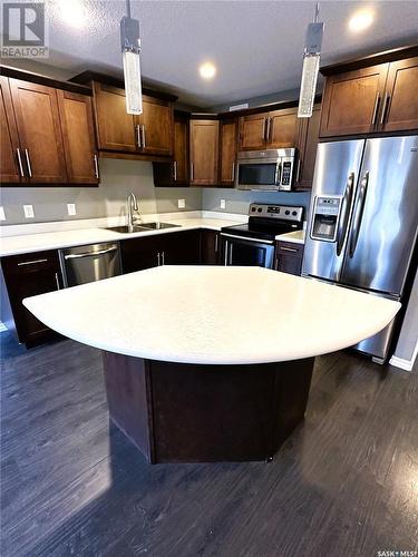 245 4002 Sandhill Crescent, Regina, SK - Indoor Photo Showing Kitchen With Double Sink