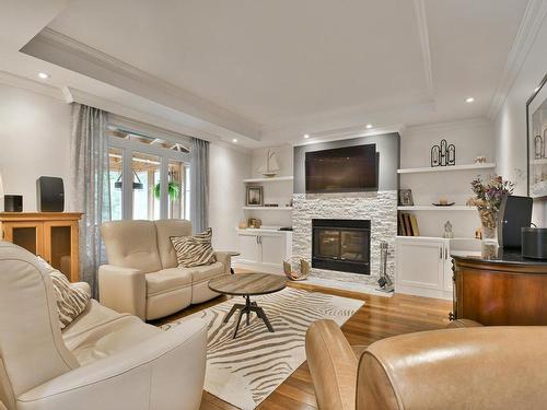 Family room - 58 Rue Champêtre, Saint-Hippolyte, QC - Indoor Photo Showing Living Room With Fireplace