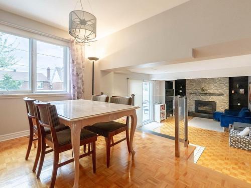 Salle Ã  manger - 7820 Rue Nadeau, Brossard, QC - Indoor Photo Showing Dining Room With Fireplace