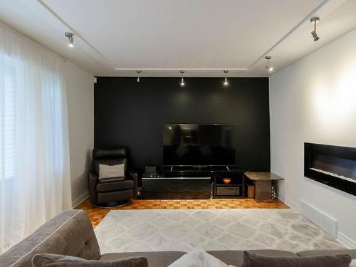 Salon - 7820 Rue Nadeau, Brossard, QC - Indoor Photo Showing Living Room With Fireplace