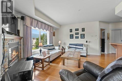 611 Shuswap Street Sw Unit# #204, Salmon Arm, BC - Indoor Photo Showing Living Room With Fireplace