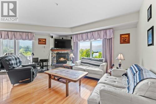 611 Shuswap Street Sw Unit# #204, Salmon Arm, BC - Indoor Photo Showing Living Room With Fireplace