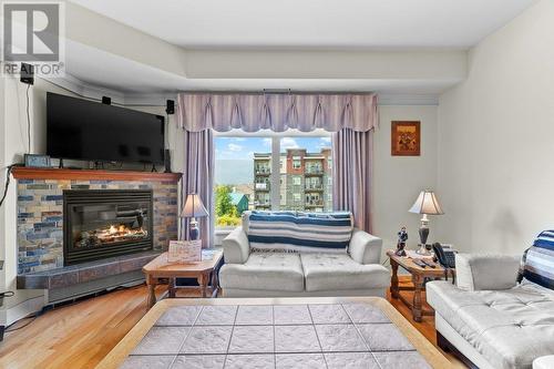 611 Shuswap Street Sw Unit# #204, Salmon Arm, BC - Indoor Photo Showing Living Room With Fireplace