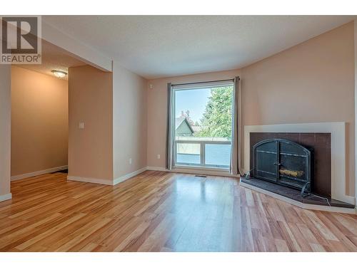 2100 43 Avenue Unit# 107, Vernon, BC - Indoor Photo Showing Living Room With Fireplace