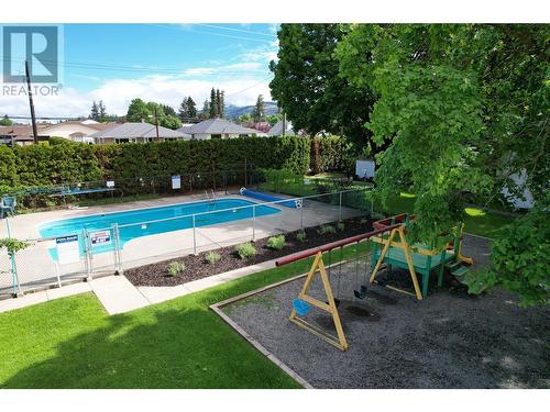 2100 43 Avenue Unit# 107, Vernon, BC - Outdoor With In Ground Pool With Backyard