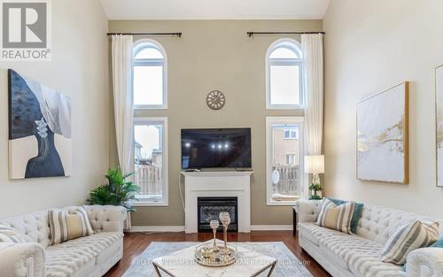 4 Hawkweed Manor, Markham (Box Grove), ON - Indoor Photo Showing Living Room With Fireplace