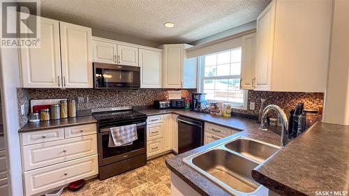 2151 95Th Street, North Battleford, SK - Indoor Photo Showing Kitchen With Double Sink