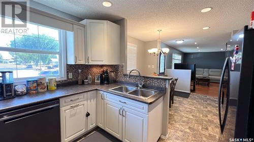 2151 95Th Street, North Battleford, SK - Indoor Photo Showing Kitchen With Double Sink