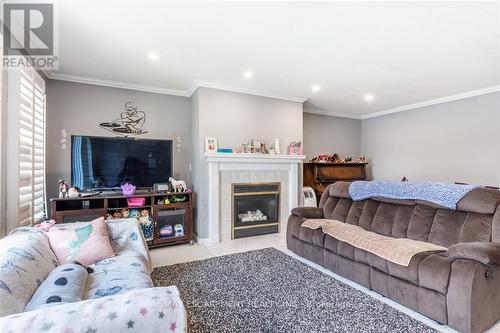 24 Spartan Avenue, Hamilton (Stoney Creek Industrial), ON - Indoor Photo Showing Living Room With Fireplace