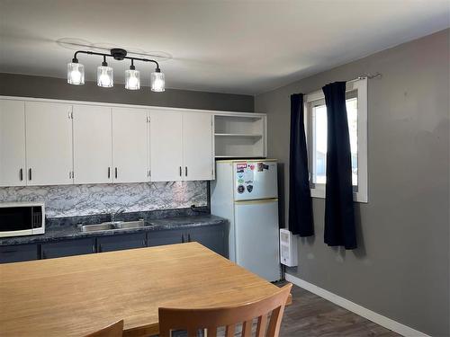 59 Second Avenue, Swan River, MB - Indoor Photo Showing Kitchen With Double Sink