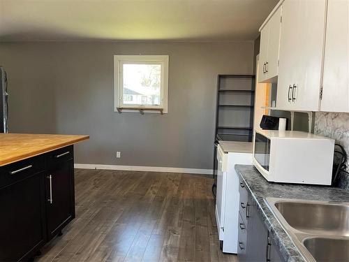 59 Second Avenue, Swan River, MB - Indoor Photo Showing Kitchen With Double Sink