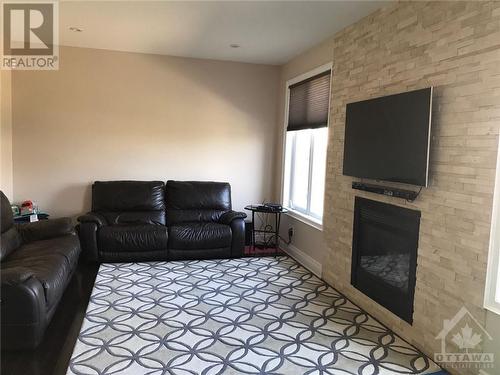 129 Rocky Hill Drive, Ottawa, ON - Indoor Photo Showing Living Room With Fireplace